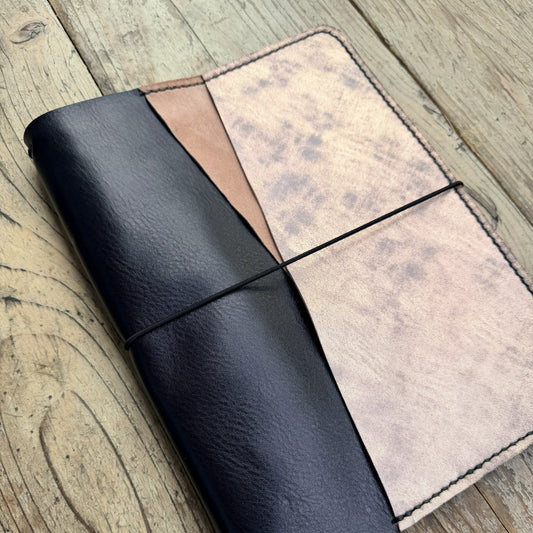 A5 size leather planner cover in Nero angled view
