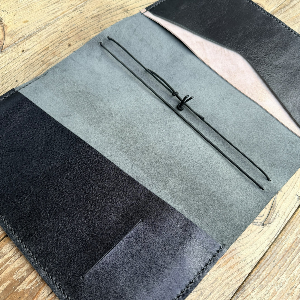 A5 size planner cover in Nero leather with insert pockets