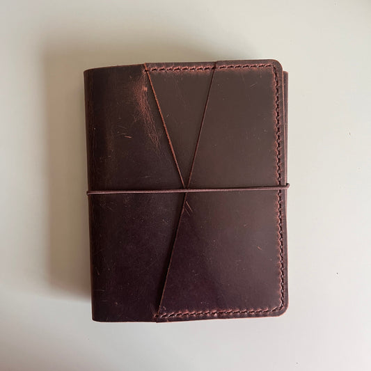 Closed reverse view of A6 Areti Trifold cover in Espresso leather