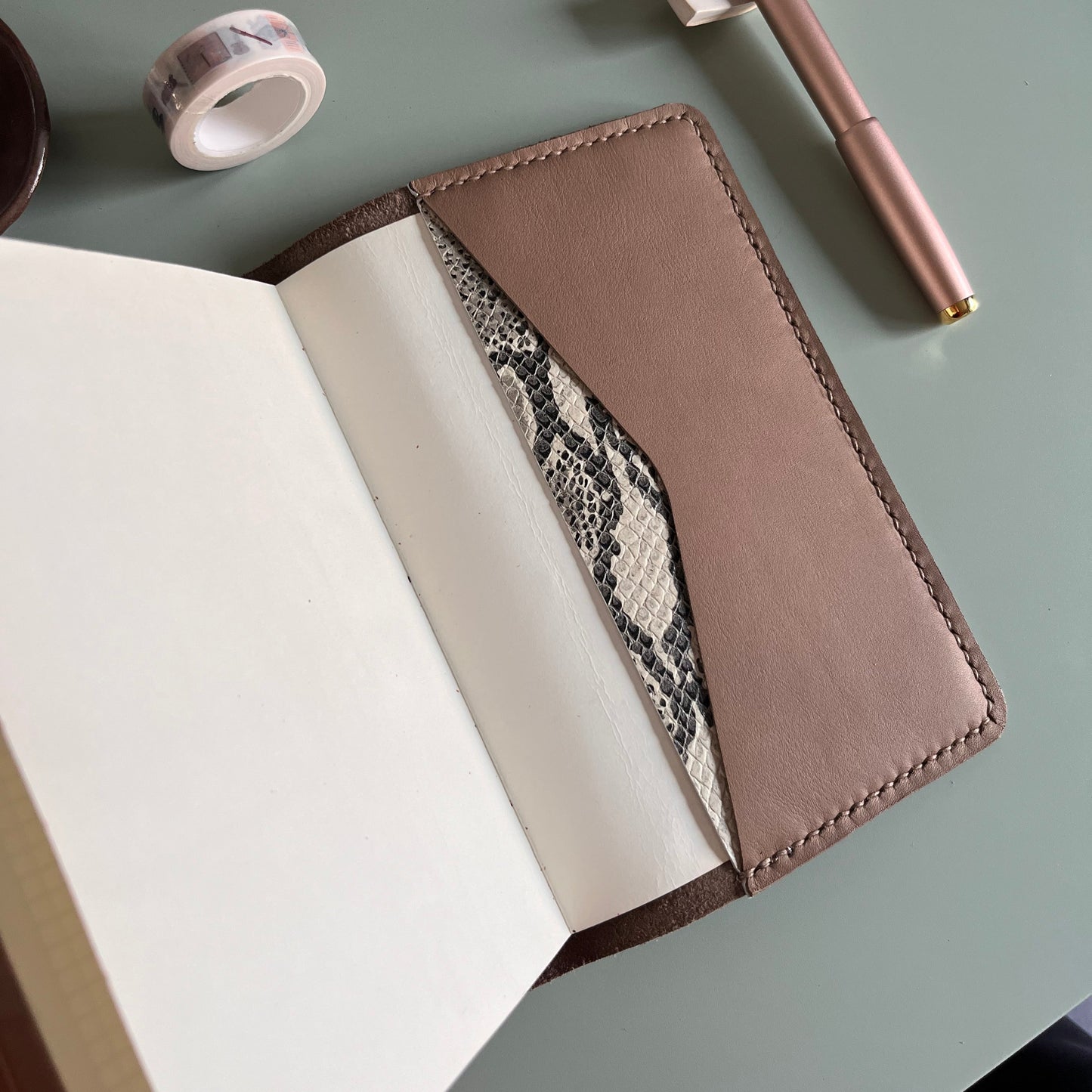Open B6 Petras leather planner cover with diagonal pocket layout