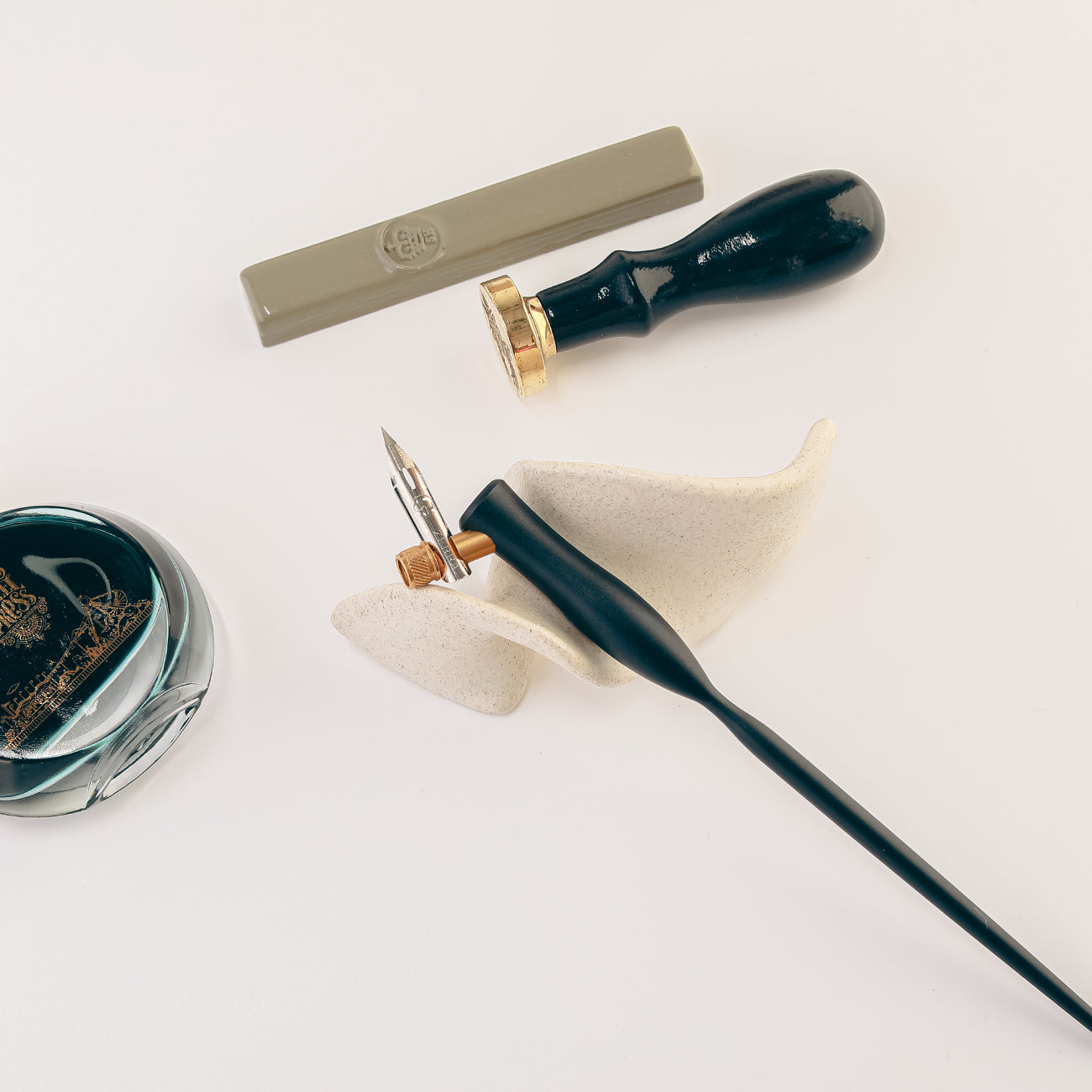 Ceramic pen rests for fountain pens and writing desks