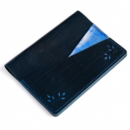 A5 cover in Storm leather angled view with punch design