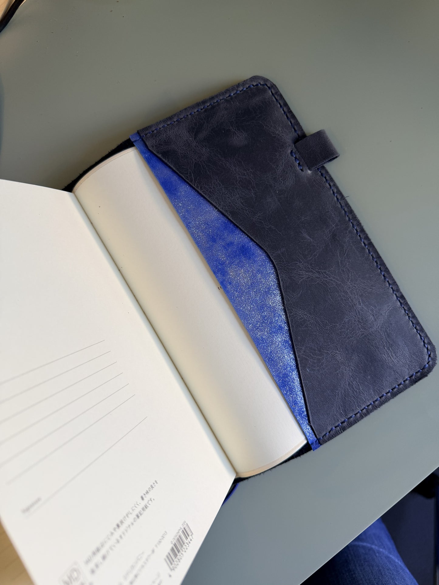 A5 leather planner cover with insert pockets and a pen loop