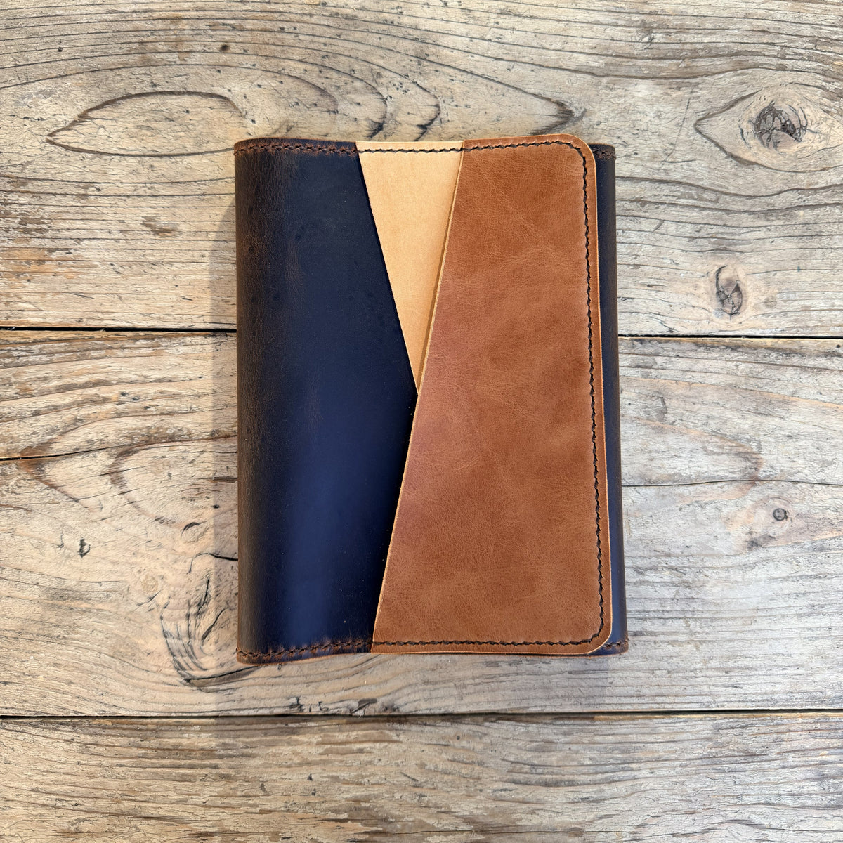 A5 trifold cover in espresso leather Petras design with undyed and cuero leatner for accent pockets.