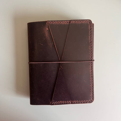 Closed reverse view of A6 Areti Trifold cover in Espresso leather
