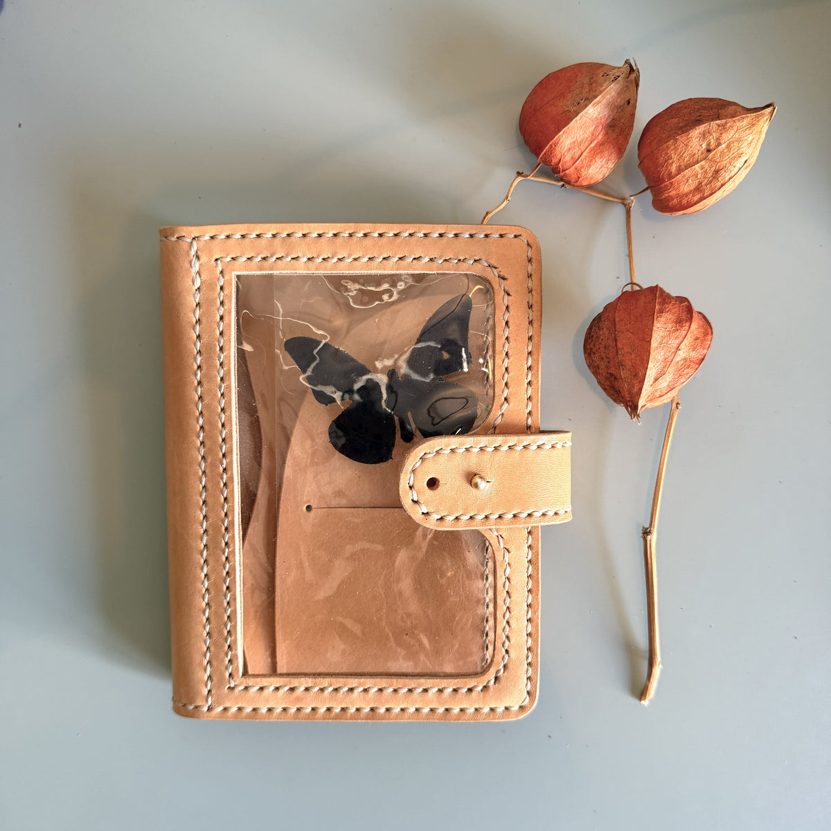 A6 Areti cover in natural Undyed leather with nip closure