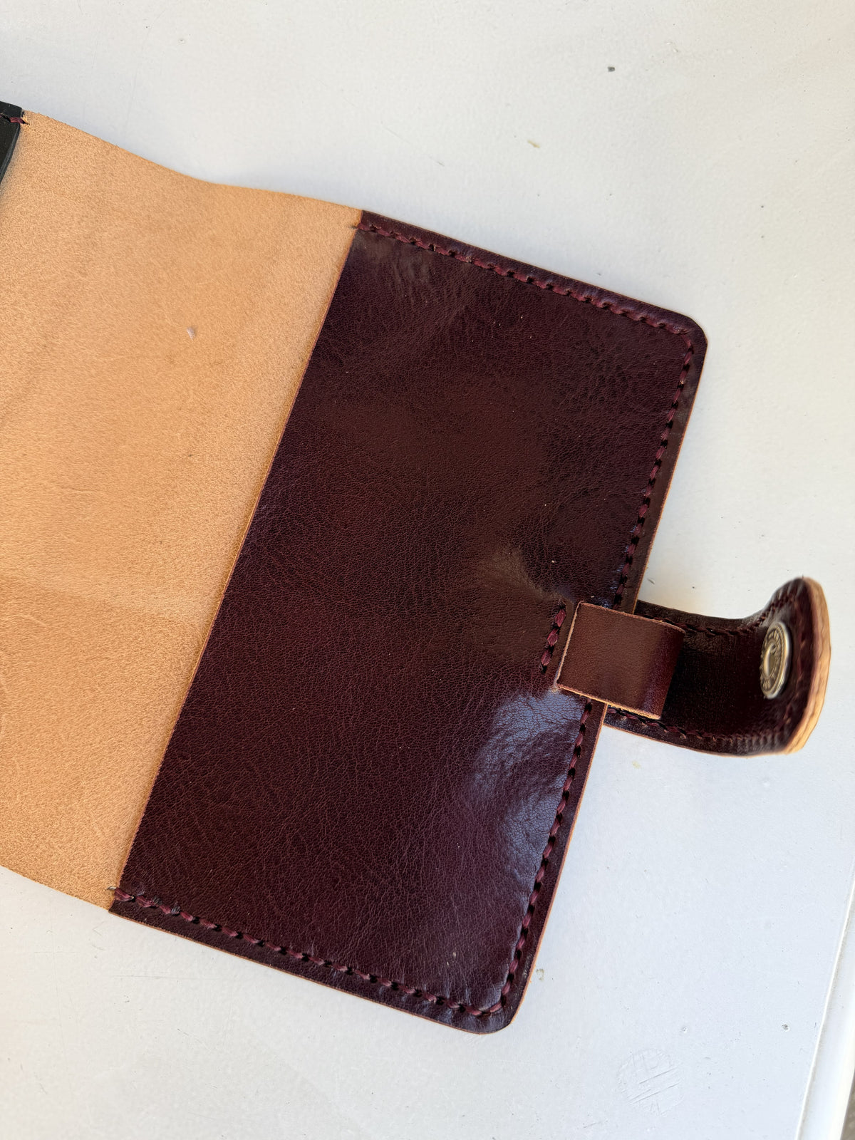 A6 leather cover with pen loop and snap closure
