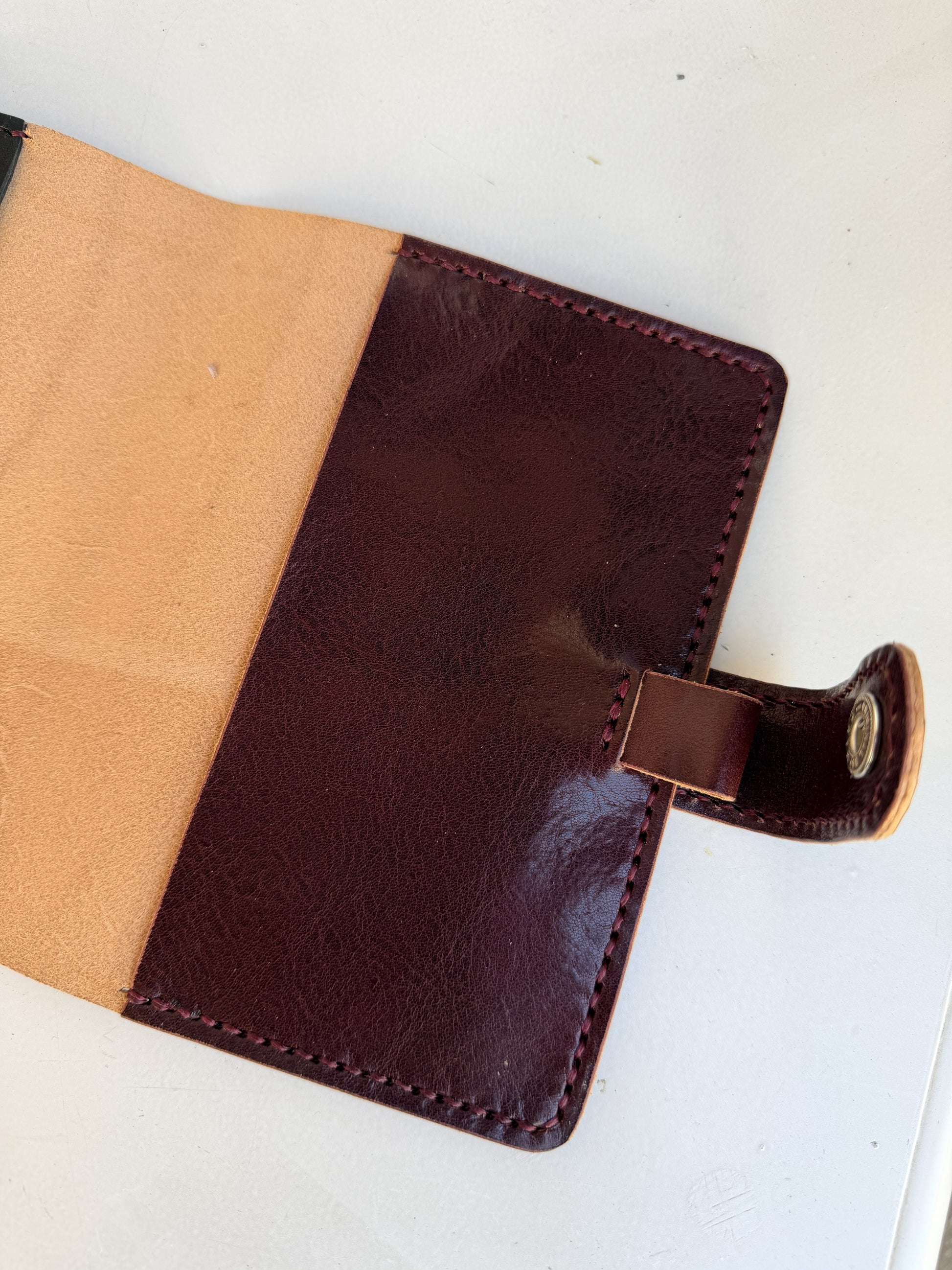 A6 leather cover with pen loop and snap closure