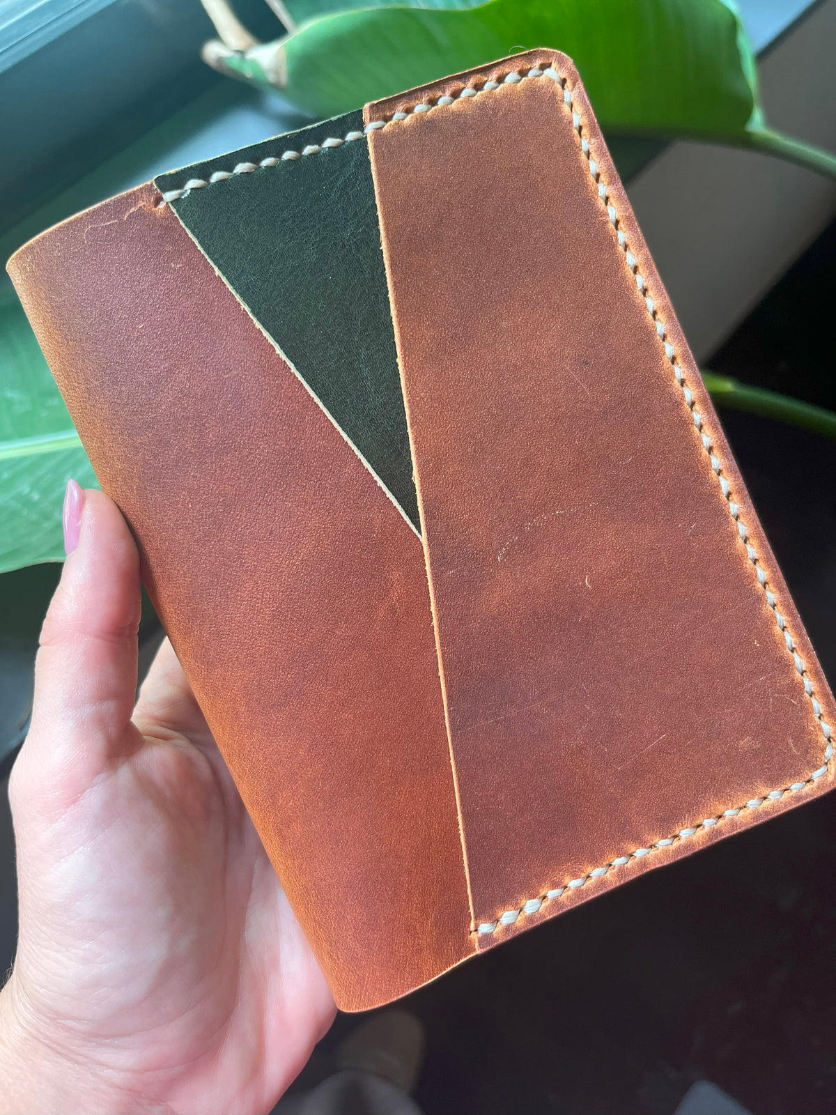Closed A6 Petras cover with layered diagonal outer pocket