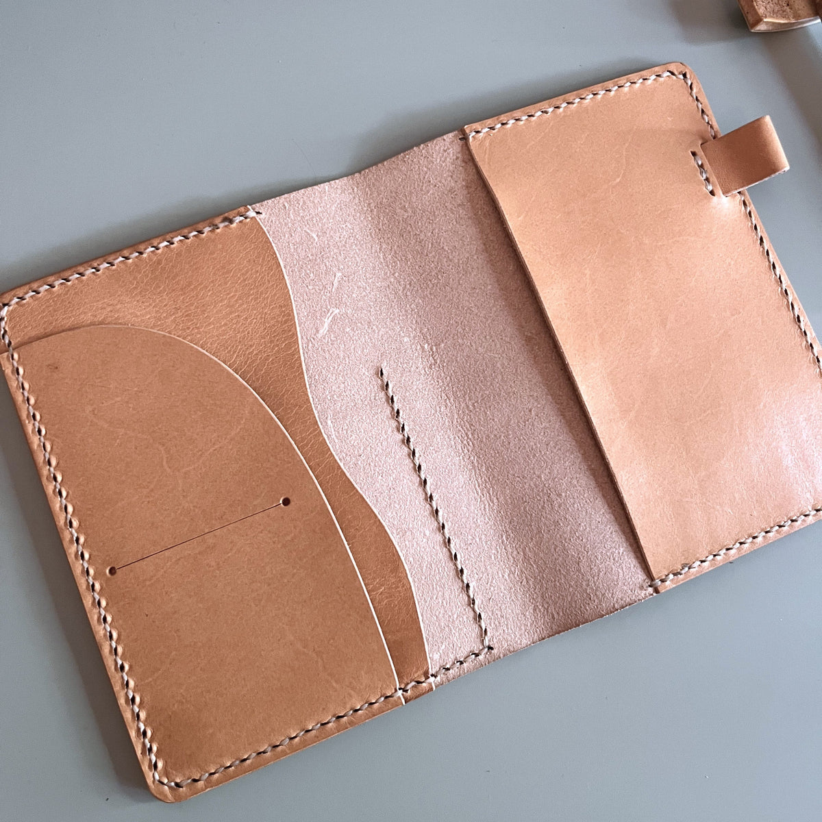 Open view of A6 Aris leather cover with curved outer pocket