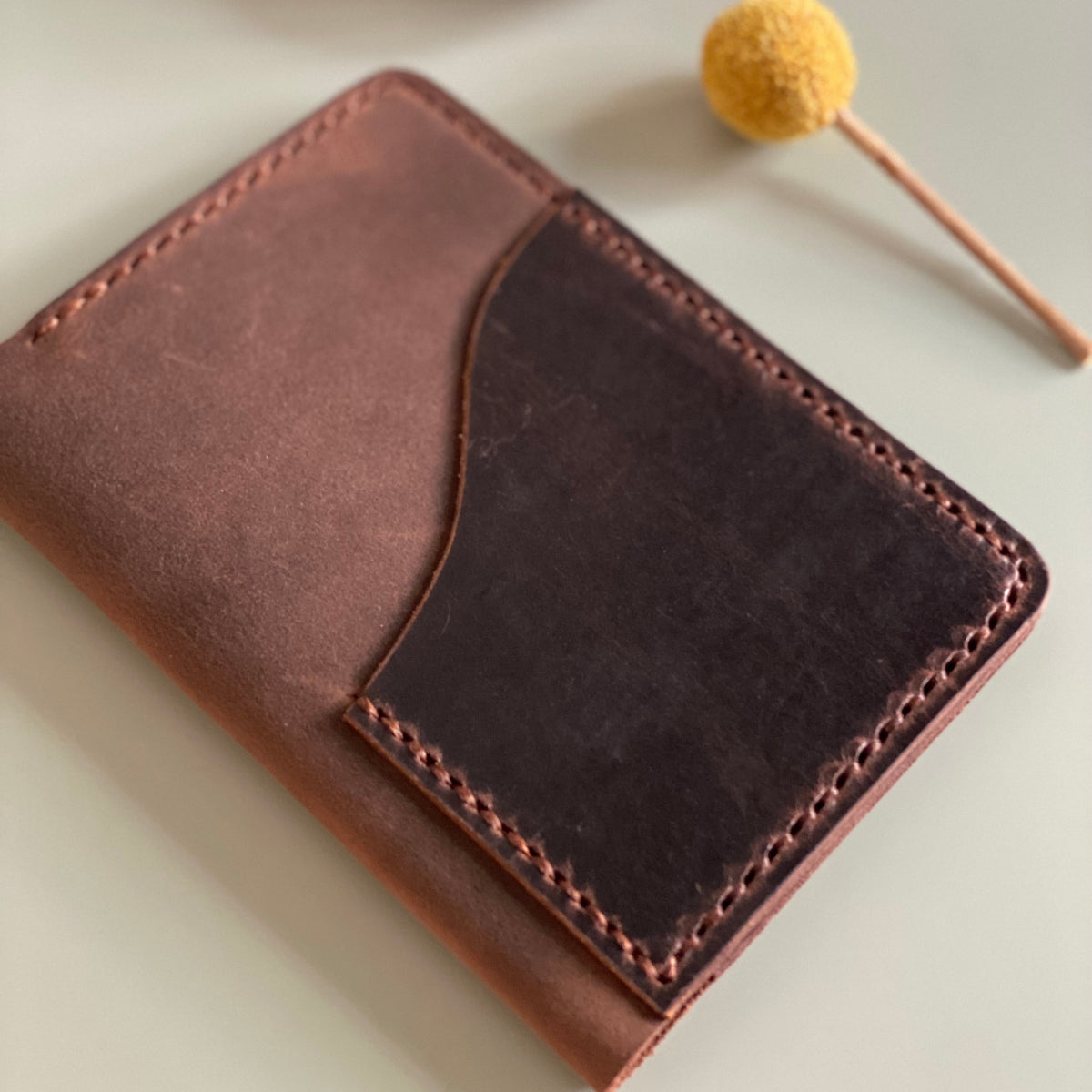 Closed Passport size leather cover with Espresso outer pocket