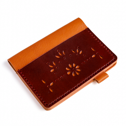 Pocket size leather cover punch flower design angled view