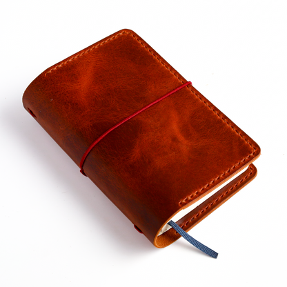 Pocket size in Cognac leather closed angled view