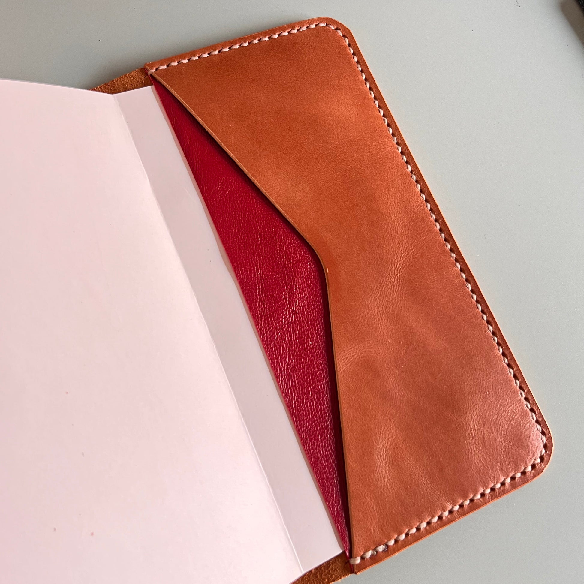 Interior pocket detail of TN leather cover in Cuero and Cherry