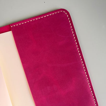 Detail of Heather accent pocket on Raspberry A5 leather cover