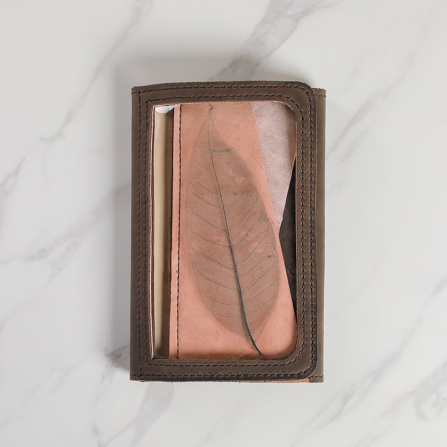 Atelier Areti leather planner cover with transparent leaf window detail