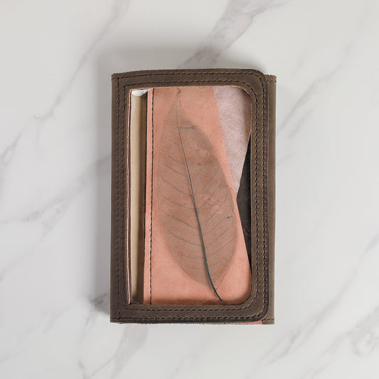 Atelier Areti leather planner cover with transparent leaf window detail