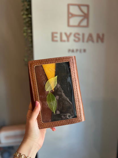 Closed B6 trifold leather cover with clear pocket detail
