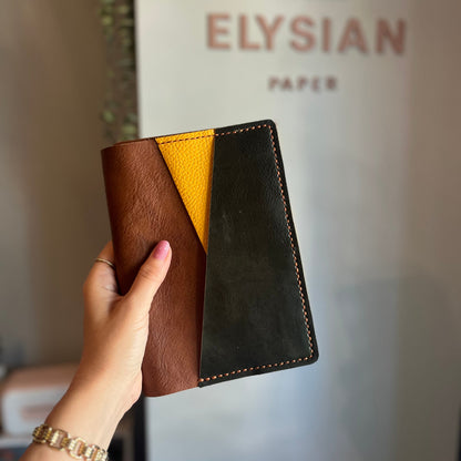 Closed B6 trifold leather cover with clear pocket detail
