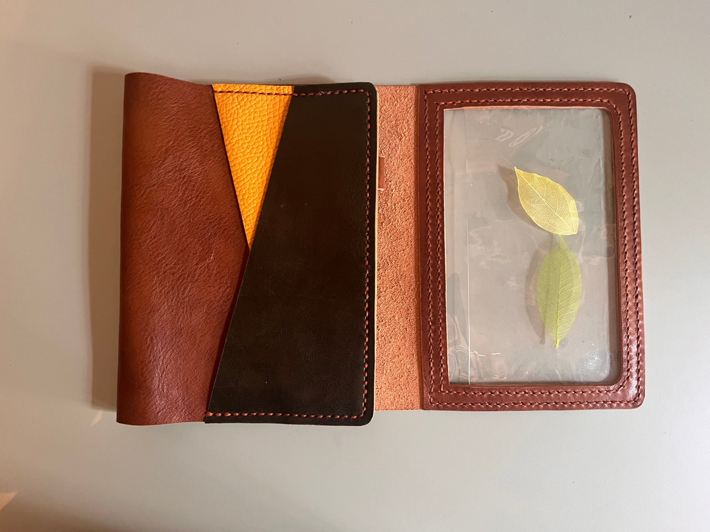 Detail of Rame, Curry and Verde leather on B6 trifold cover