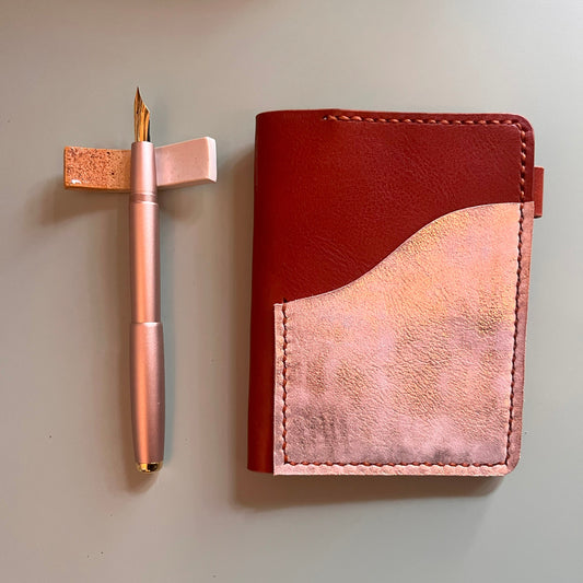 Passport cover in Ruggine leather with Salmon platina outer pocket closed view
