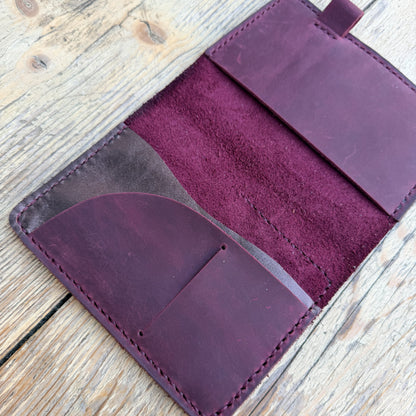 Open Passport size leather cover with interior pocket layout