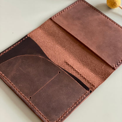 Open Passport size leather cover with interior pocket layout