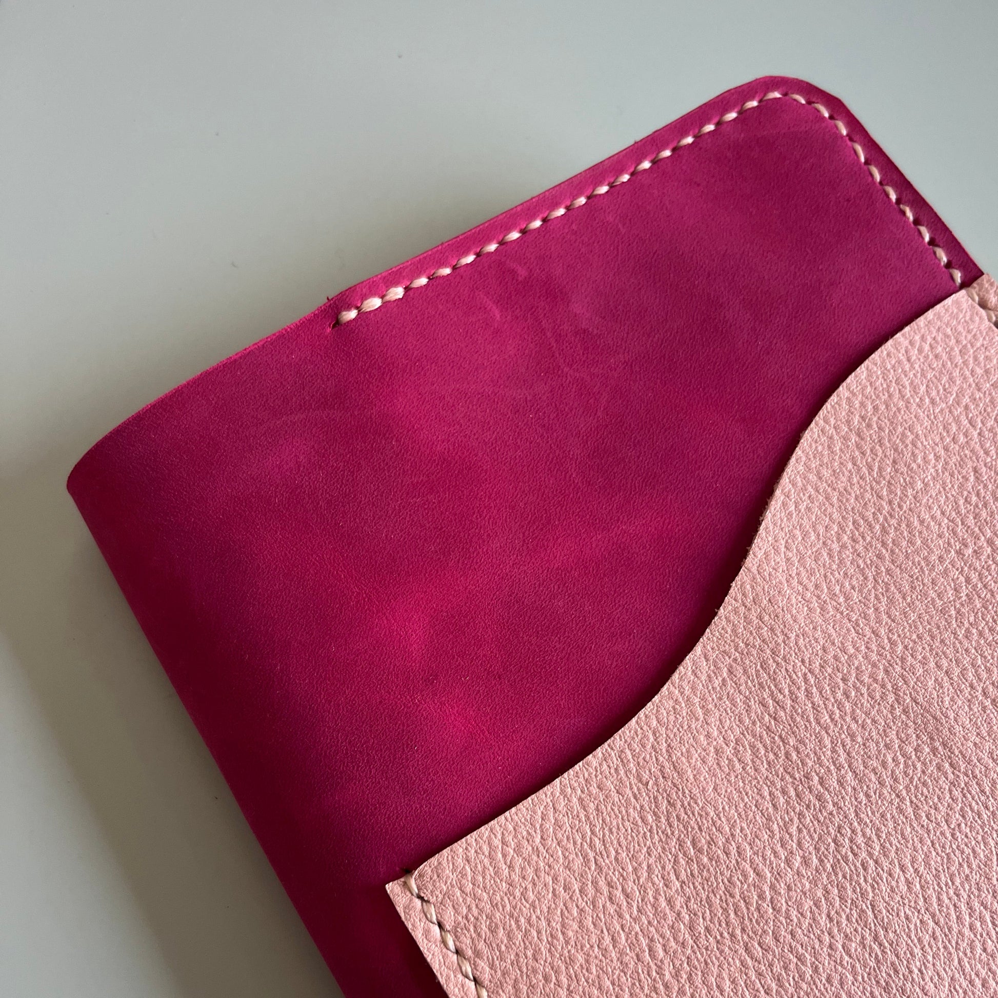 Closed A5 handmade leather cover in Raspberry leather