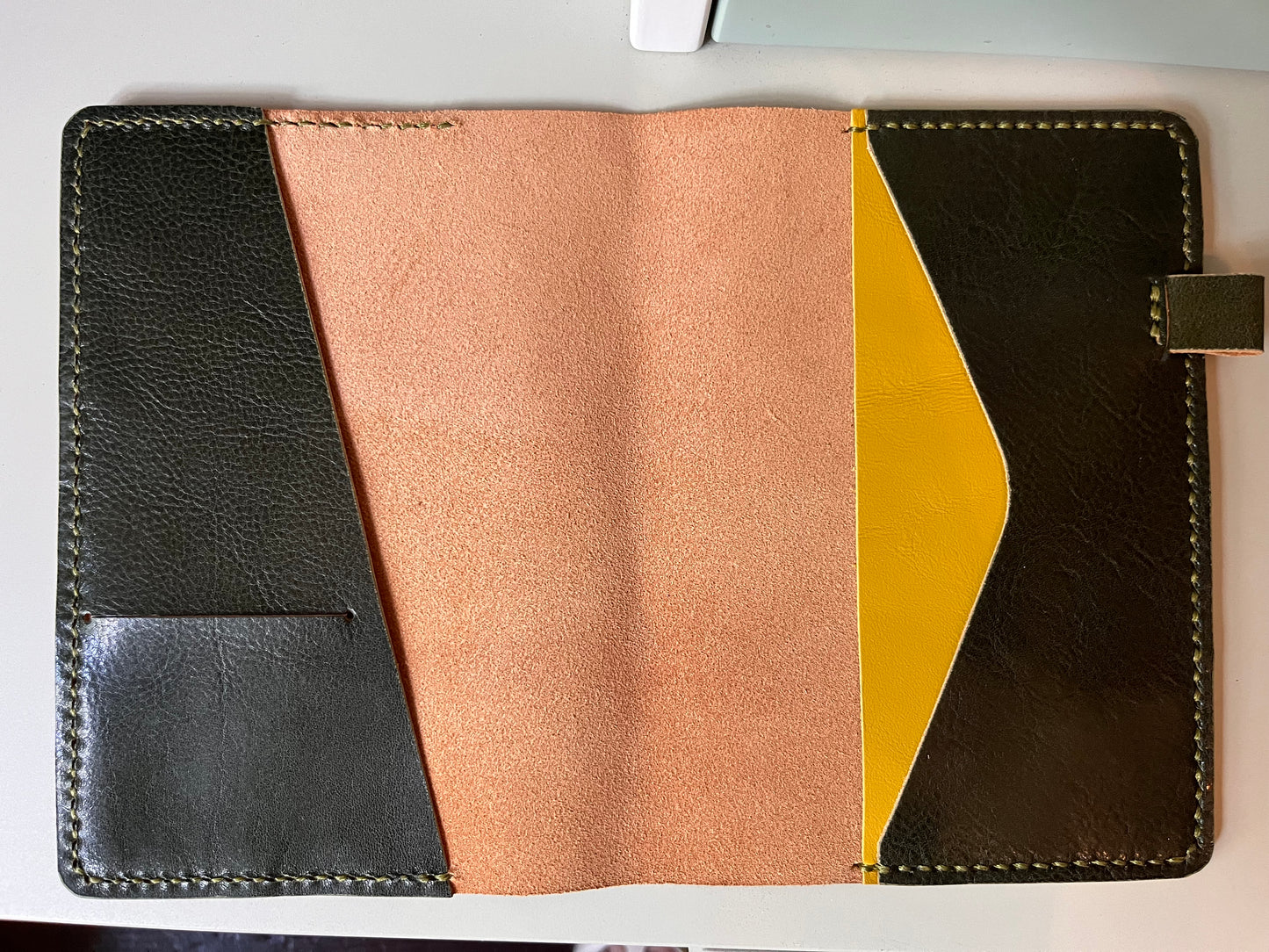 Open B6 Petras leather planner cover with diagonal pocket layout