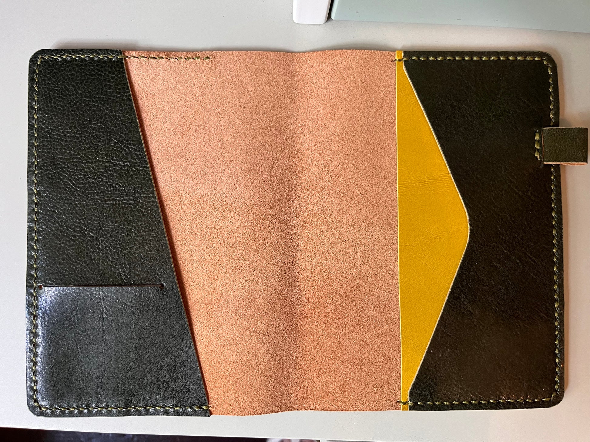 Open B6 Petras leather planner cover with diagonal pocket layout