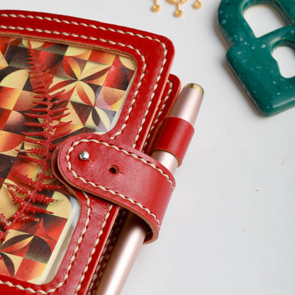 Pen loop closure detail on Pocket Areti leather cover in Rosso leather