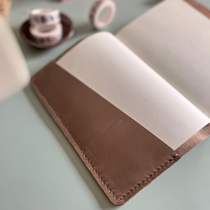 Open B6 Petras leather planner cover with diagonal pocket layout