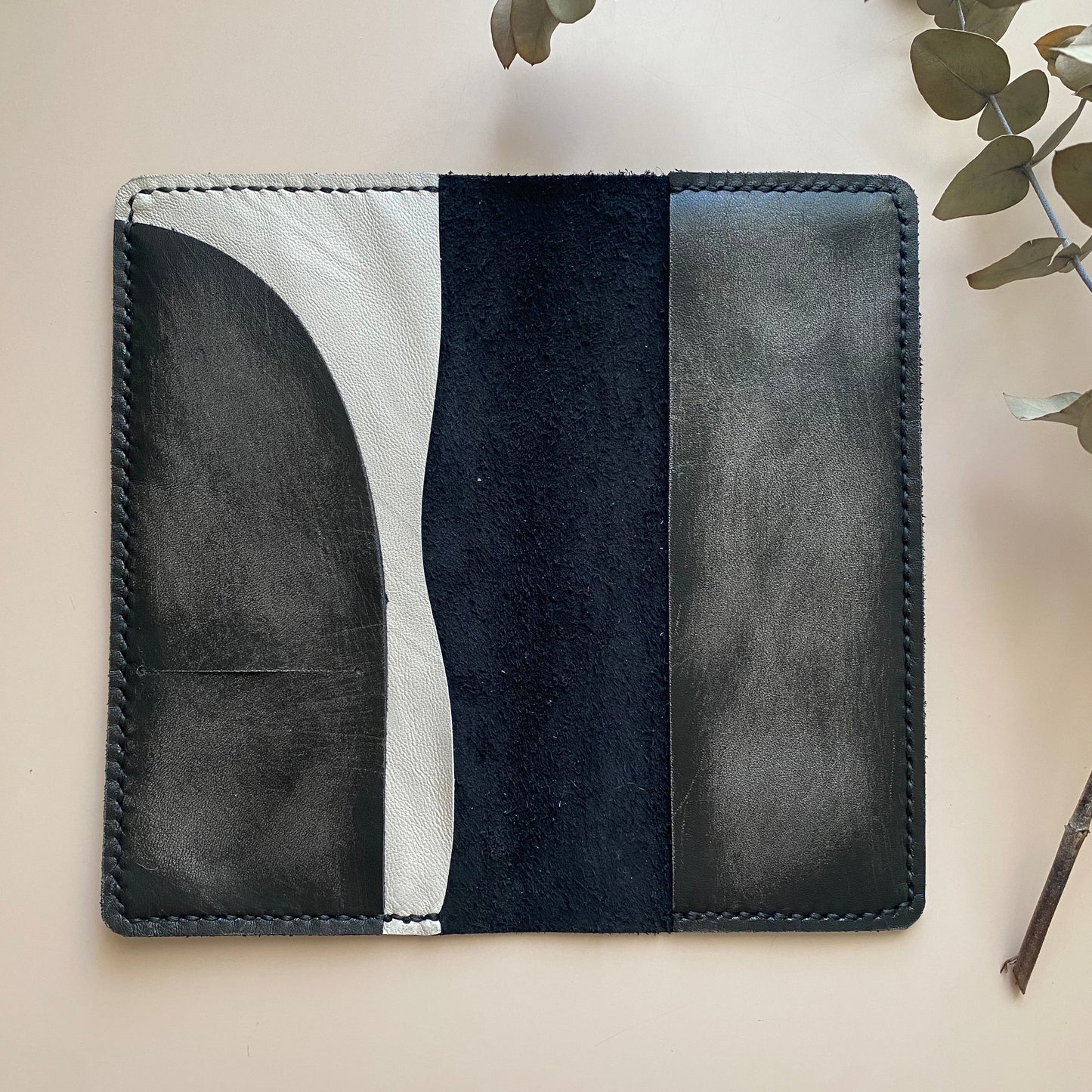 Open view of Weeks Armonia leather cover with Ice Grey detail